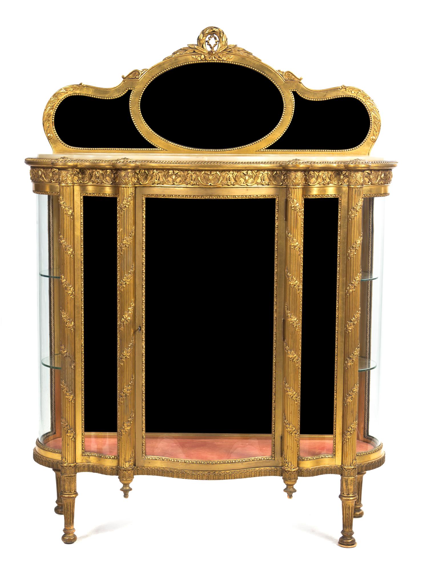 A Louis XVI Style Giltwood Vitrine, Height 67 5/8 x width 49 3/4 x depth 17 5/8 inches.