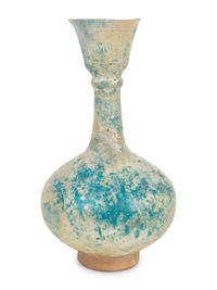An Iridescent Glazed Earthenware Flask
