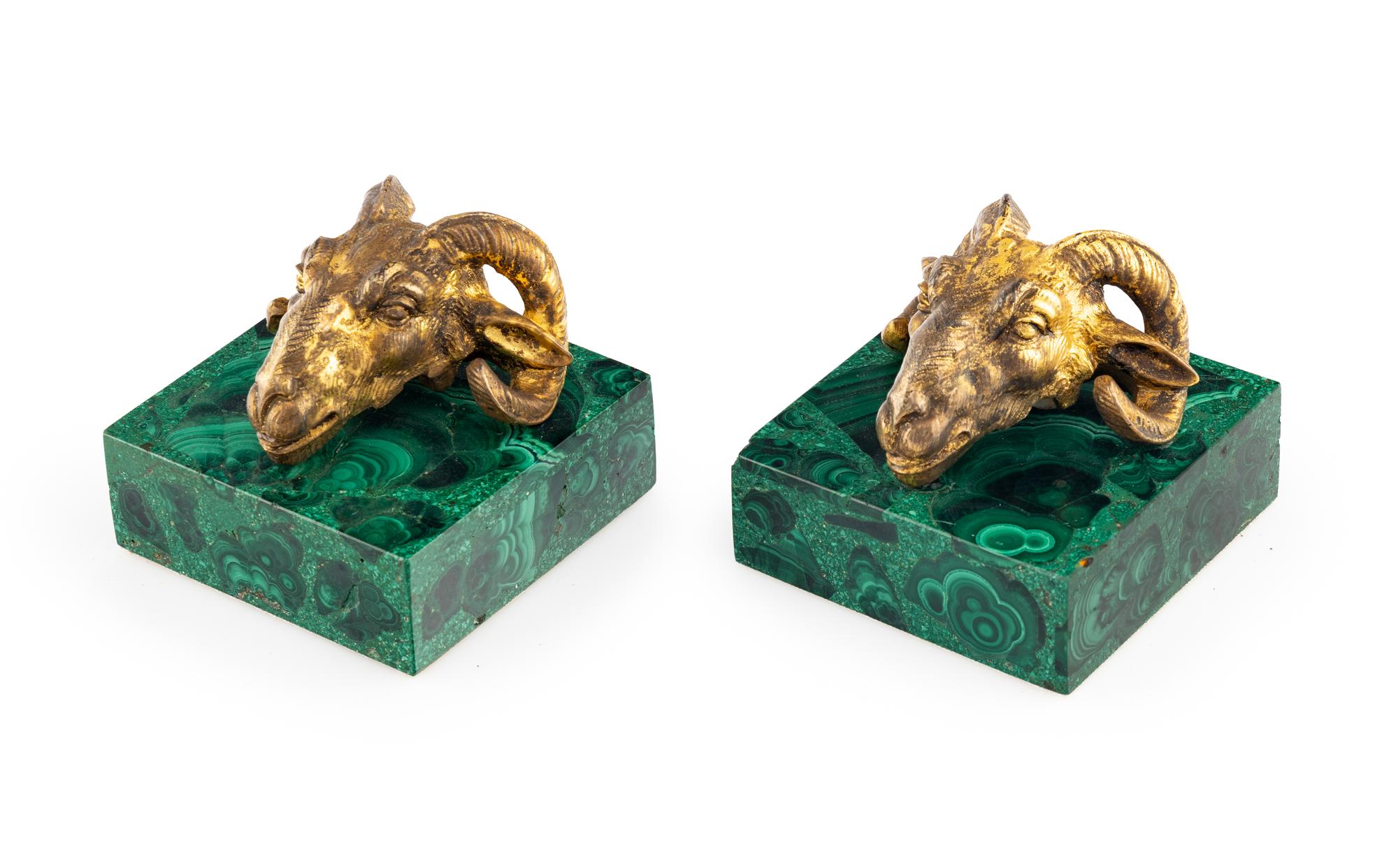 A Pair of Gilt Bronze and Malachite Ram's Head Table Ornaments