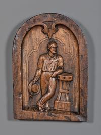 A Carved Walnut Ship Board Panel of a Sailor
