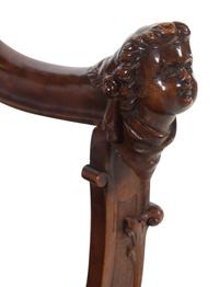 A Renaissance Revival Carved Walnut Savonarola Chair