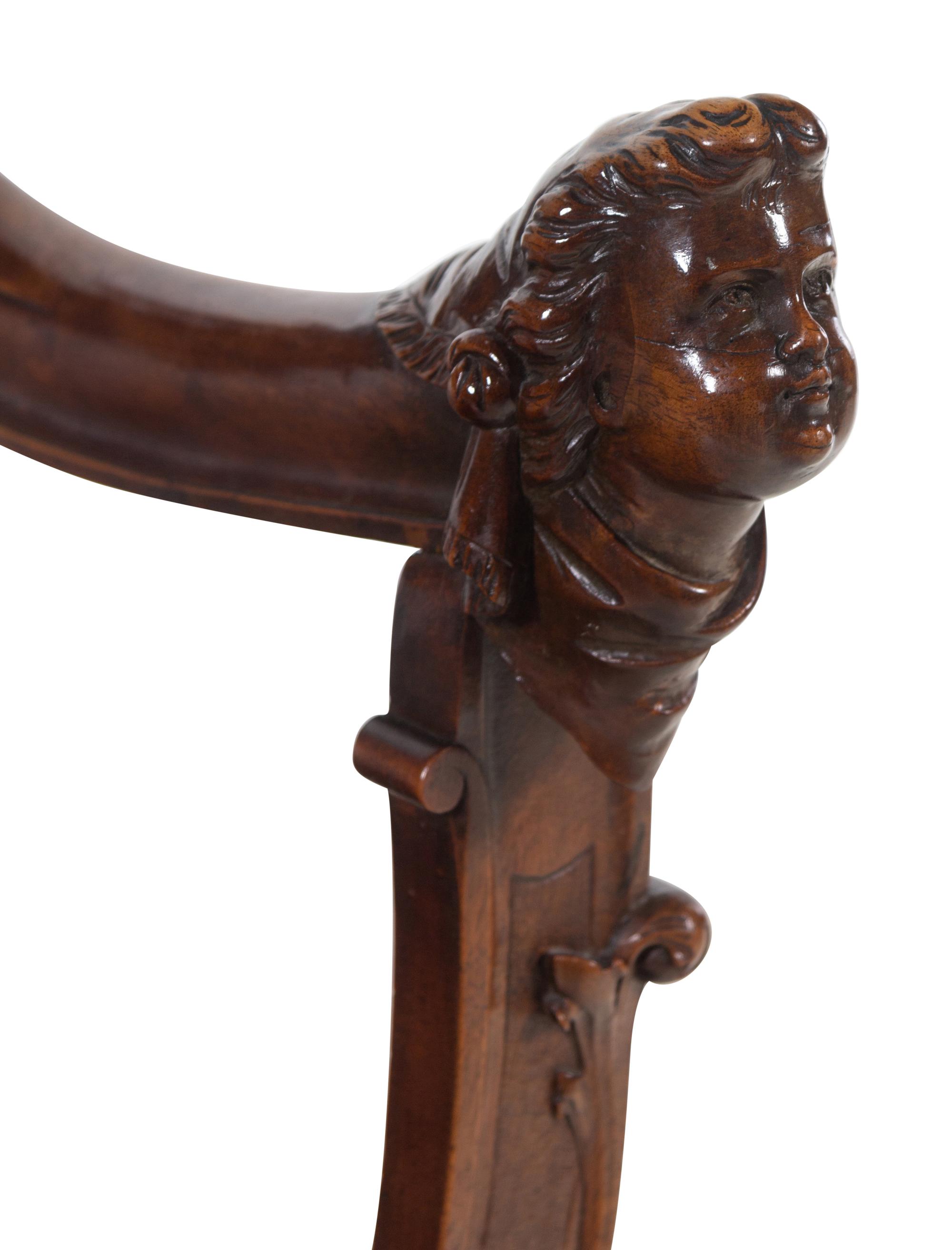A Renaissance Revival Carved Walnut Savonarola Chair