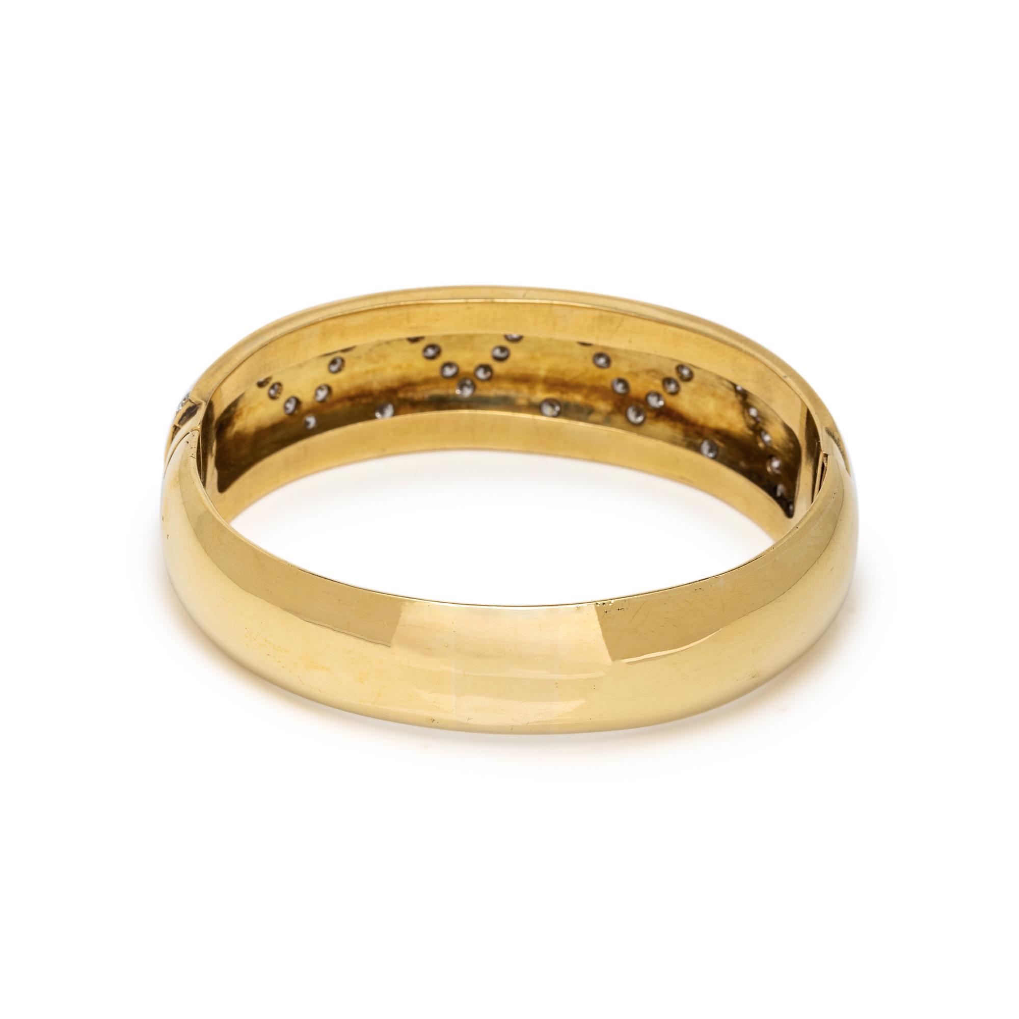 YELLOW GOLD, BLACK ENAMEL AND DIAMOND HINGED BANGLE