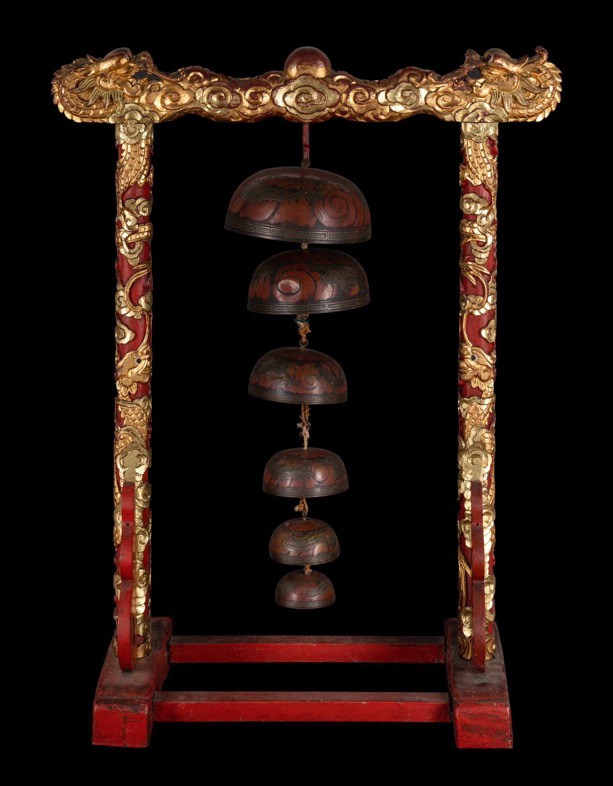 A Set of Gongs with Matching Carved Gilt and Red Lacquered Wood Stand