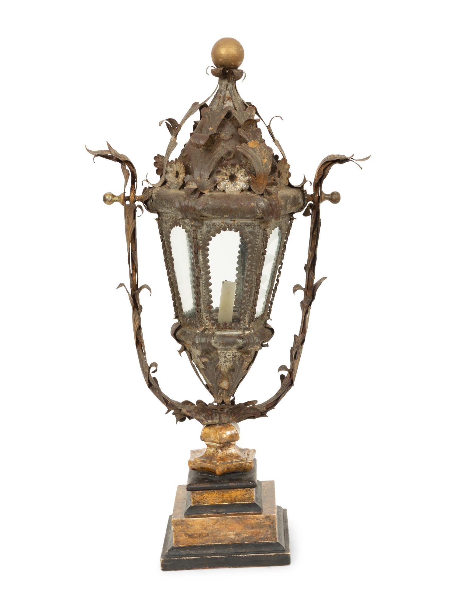 An Italian Tole Swinging Lantern on a Giltwood Stand