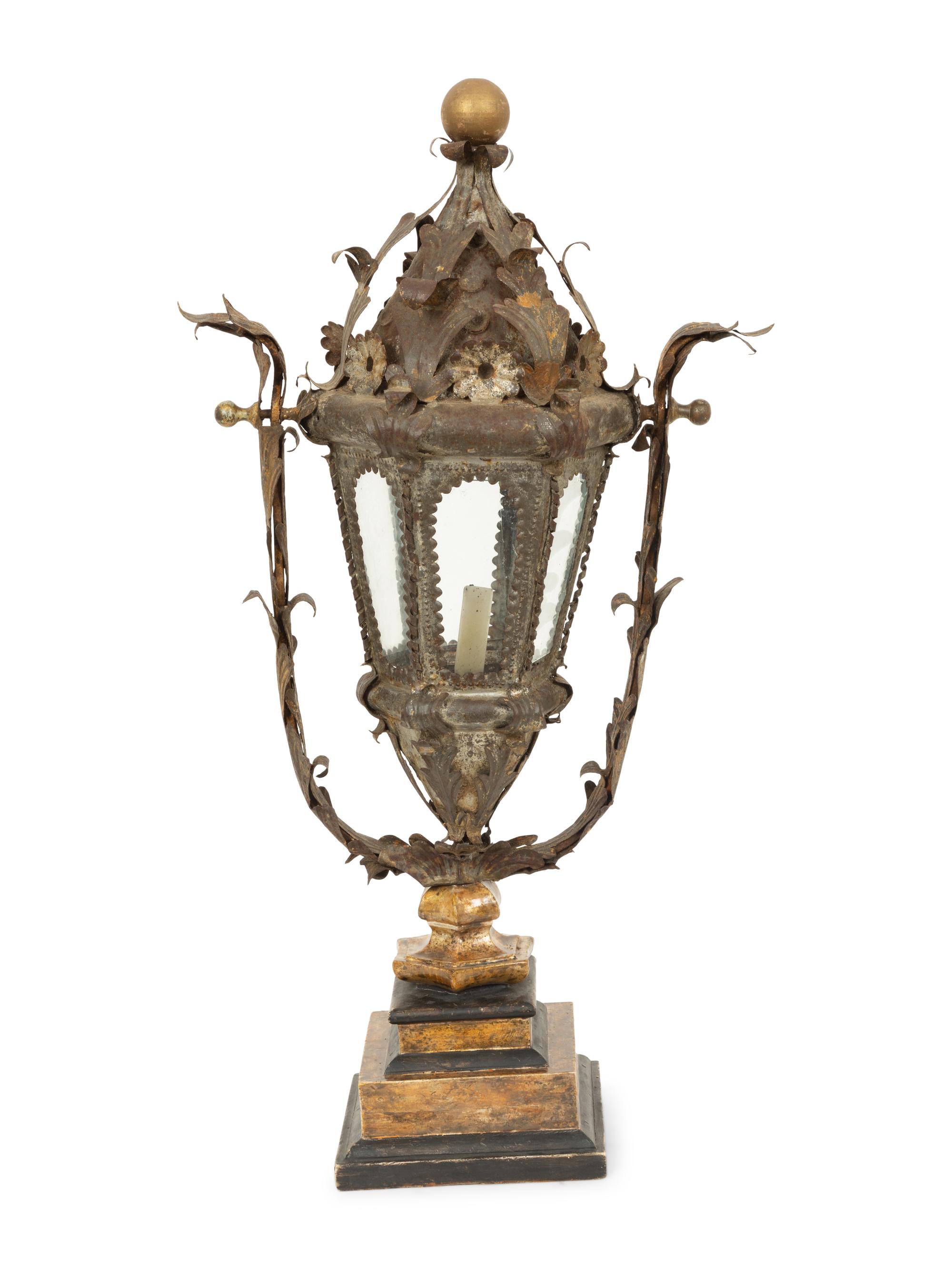 An Italian Tole Swinging Lantern on a Giltwood Stand