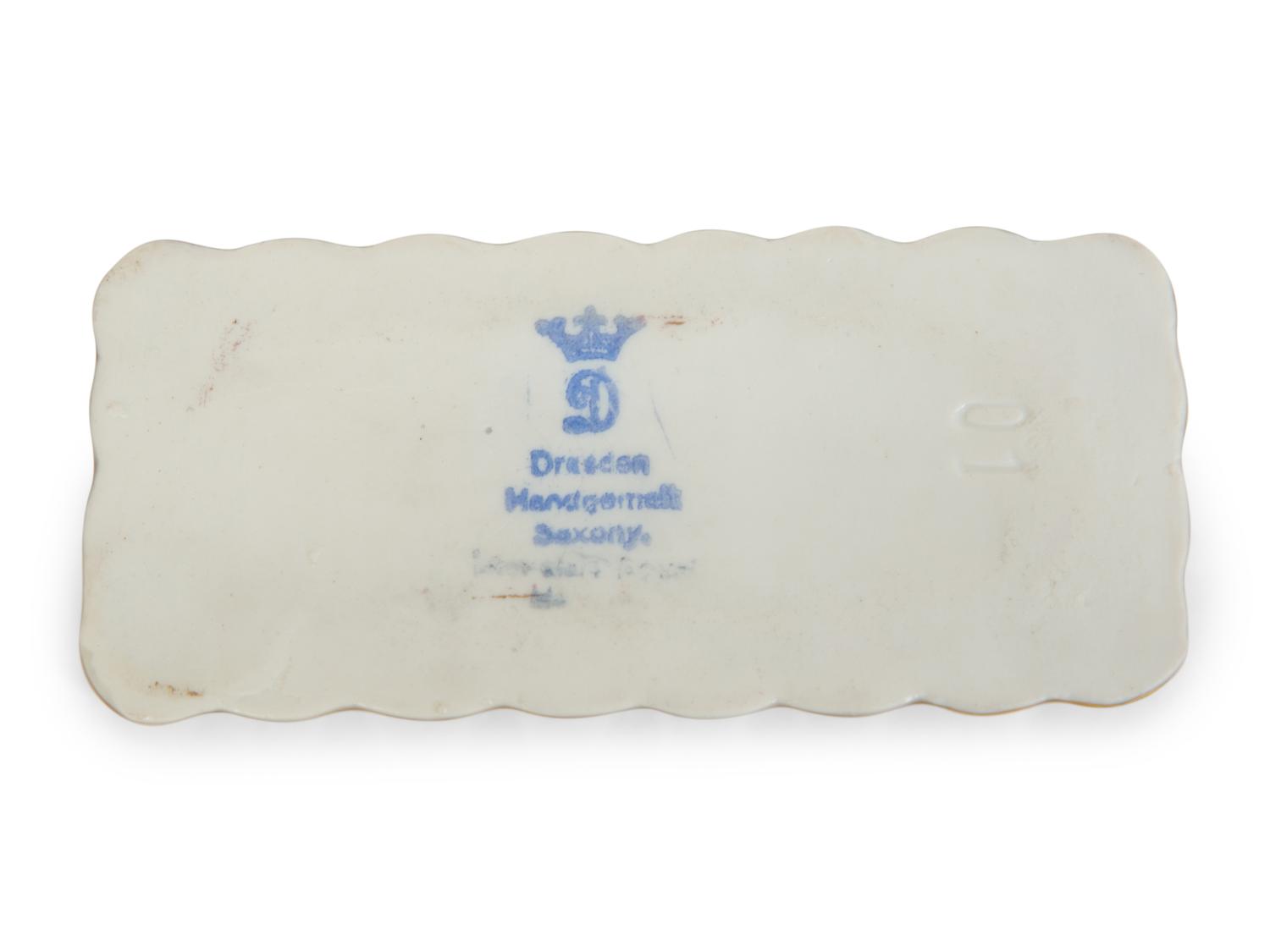 A Collection of Dresden Porcelain Place Cards, Holders and Napkin Rings