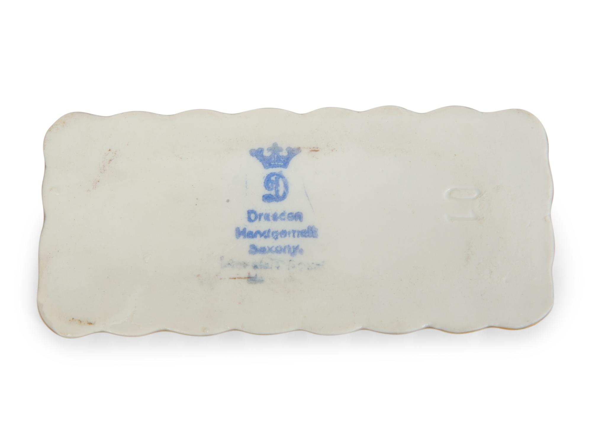 A Collection of Dresden Porcelain Place Cards, Holders and Napkin Rings