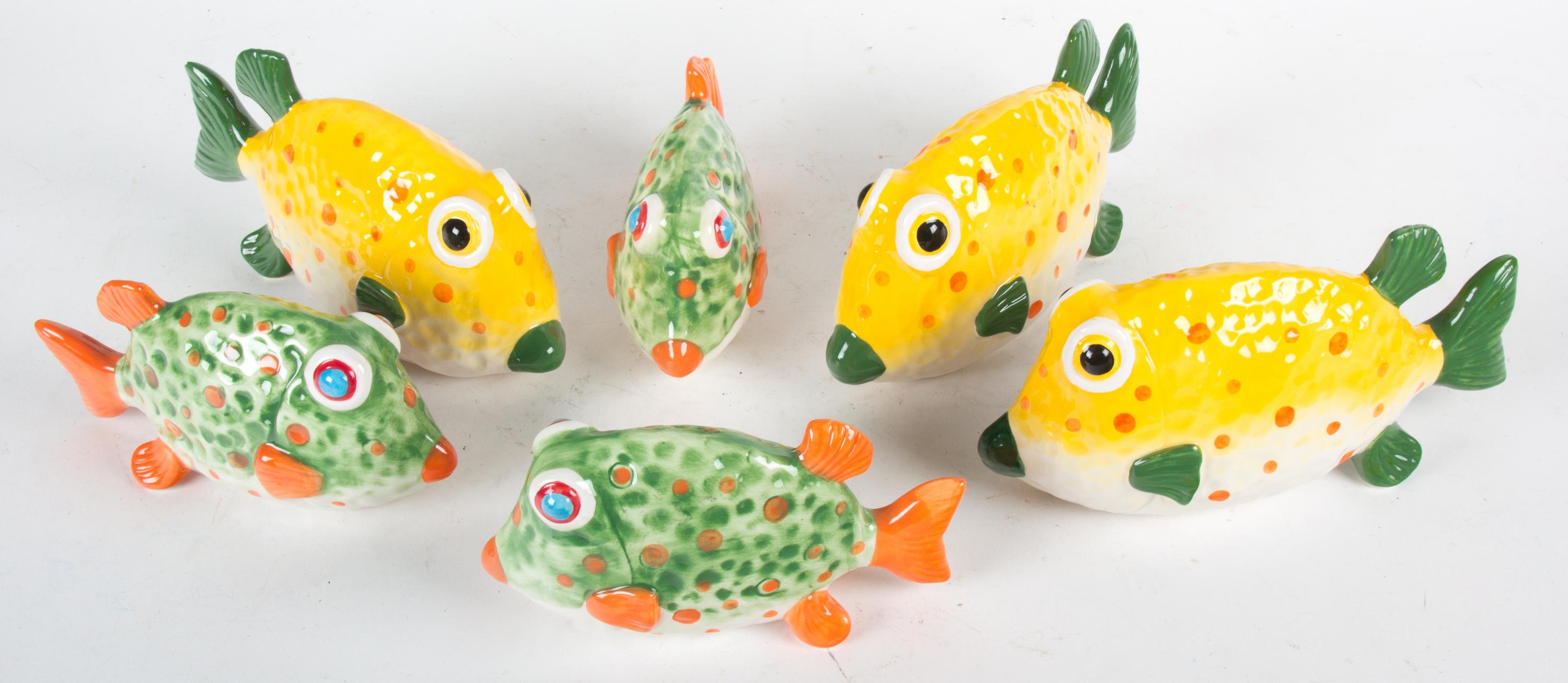 Six Glazed Pottery Fish Length of largest 10 inches.