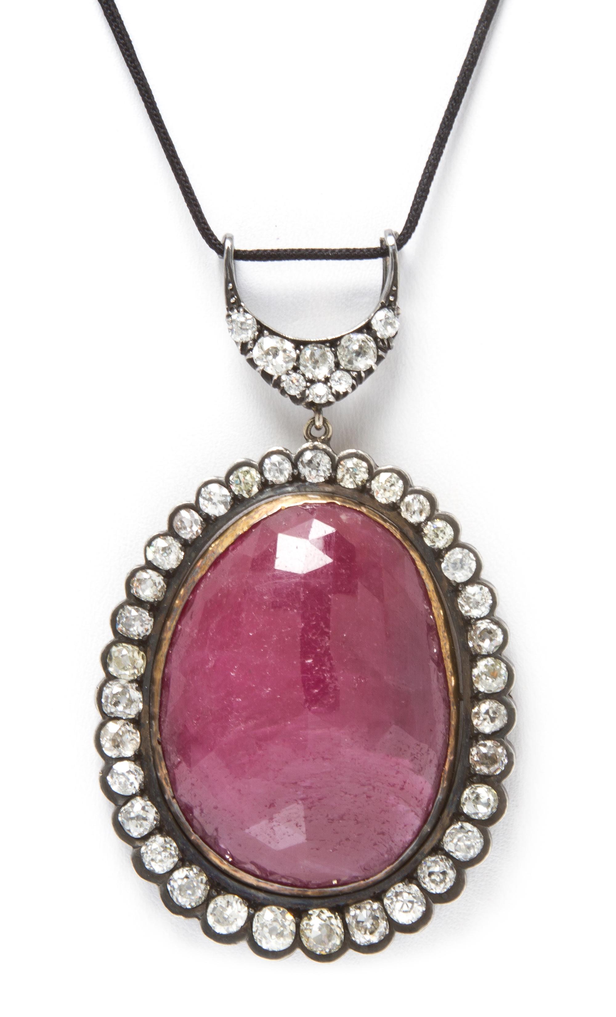 An Antique, Silver Topped Gold Natural Ruby and Diamond Pendant, 24.00 dwts.