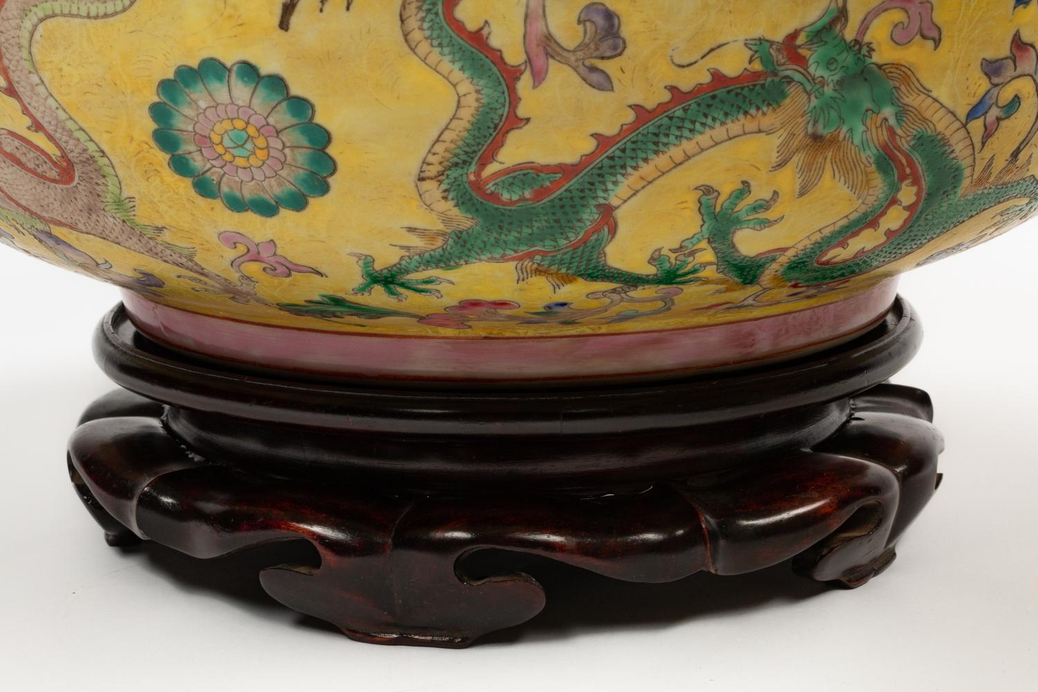 A Pair of Chinese Export Famille Jaune Porcelain Bowls with Wood Bases