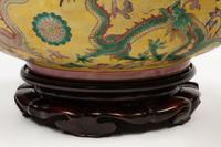 A Pair of Chinese Export Famille Jaune Porcelain Bowls with Wood Bases