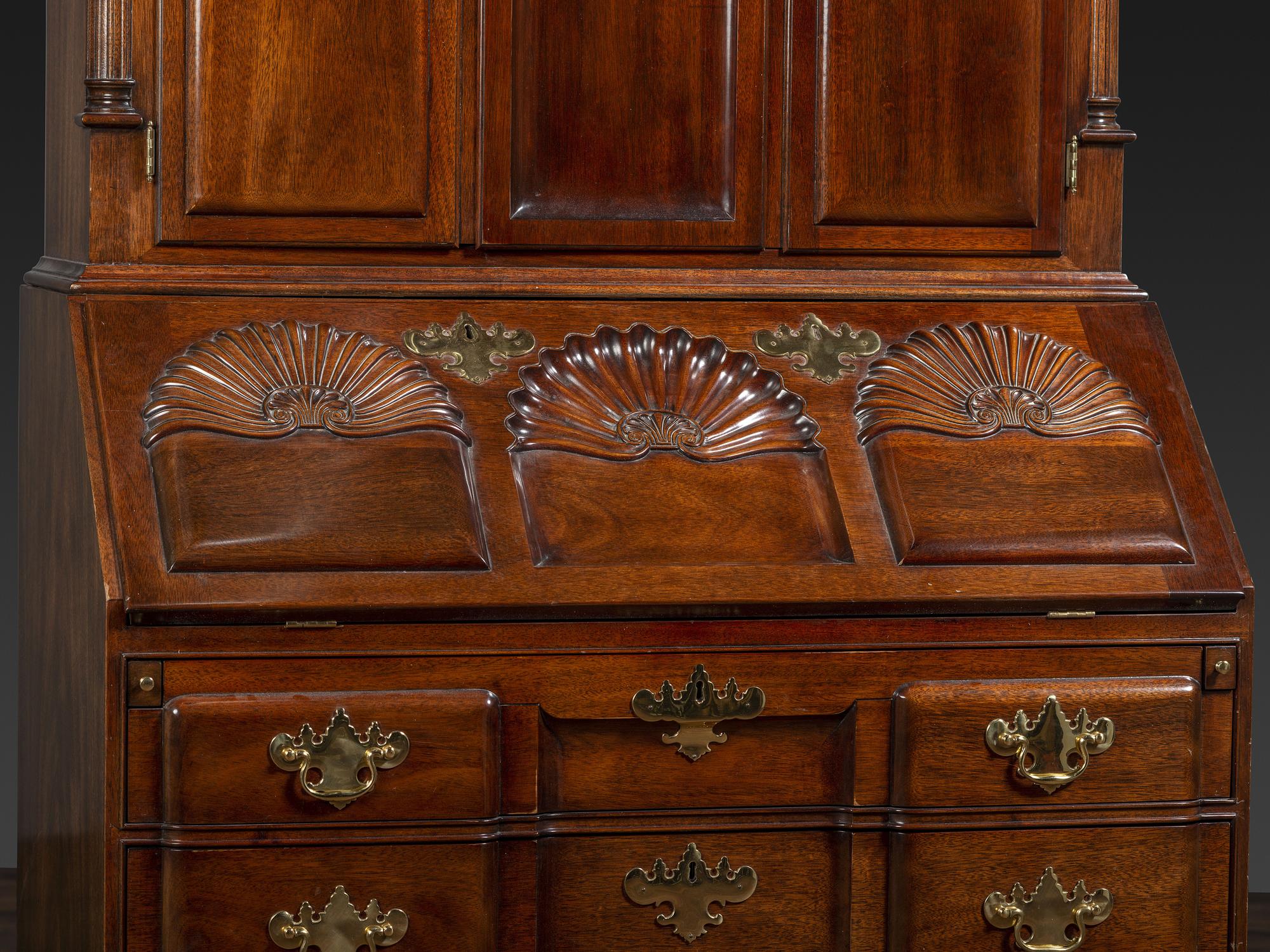 A Kindel Chippendale Revival Shell-and-Block Front Desk-and-Bookcase