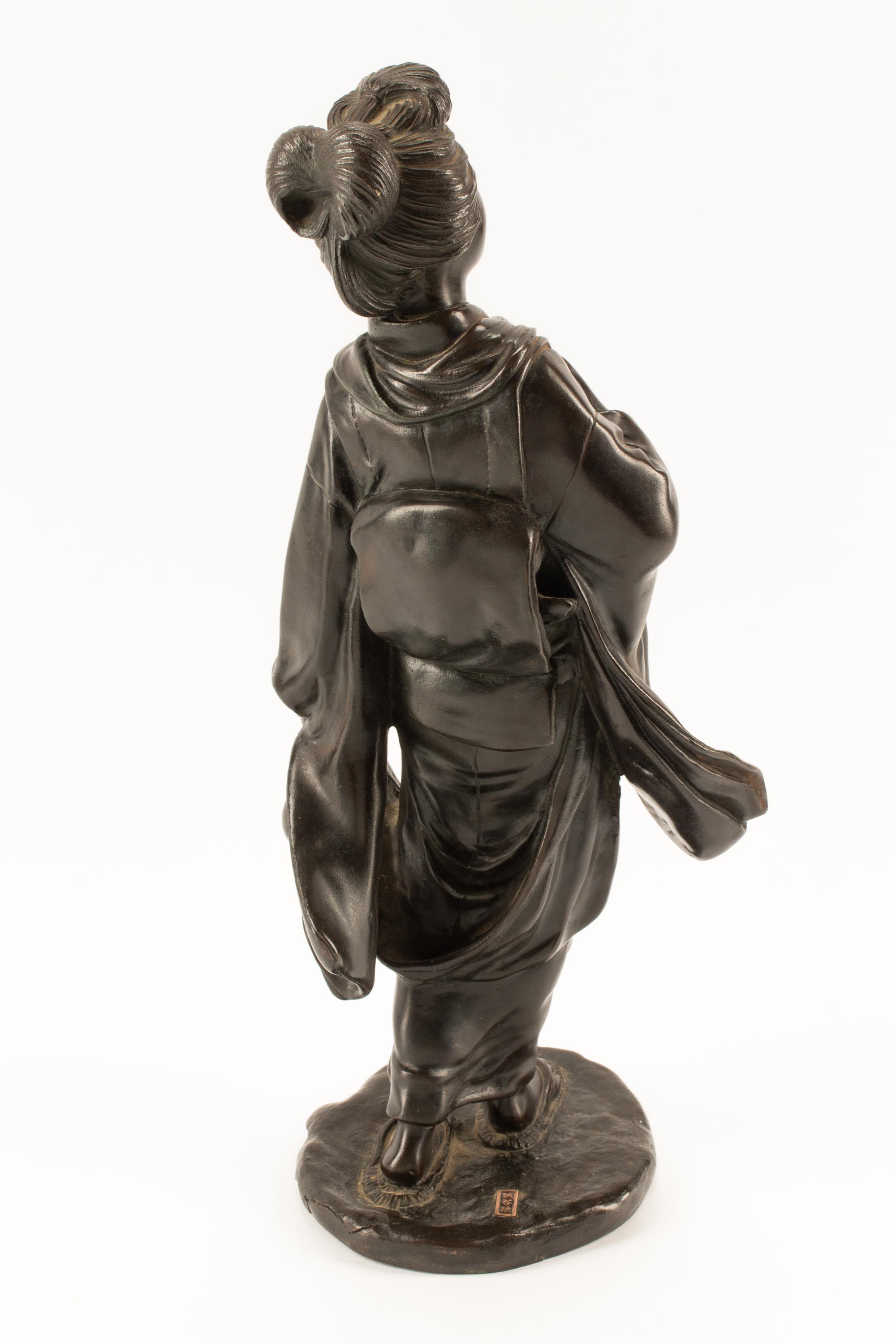 A Japanese Parcel Gilt Bronze Figure of a Lady