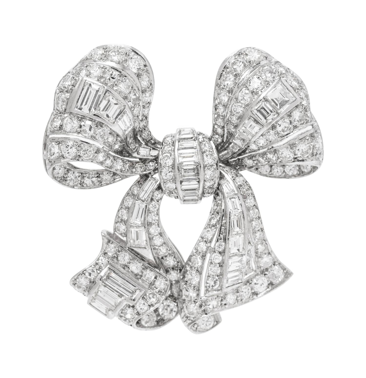 A Platinum and Diamond Bow Brooch,