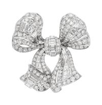 A Platinum and Diamond Bow Brooch,