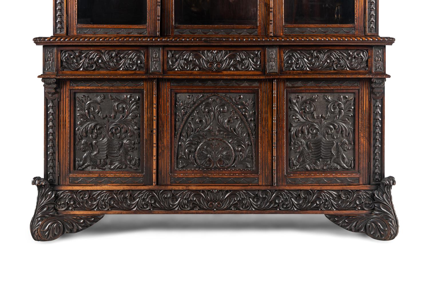 An Italian Rosewood and Carved Walnut Bookcase