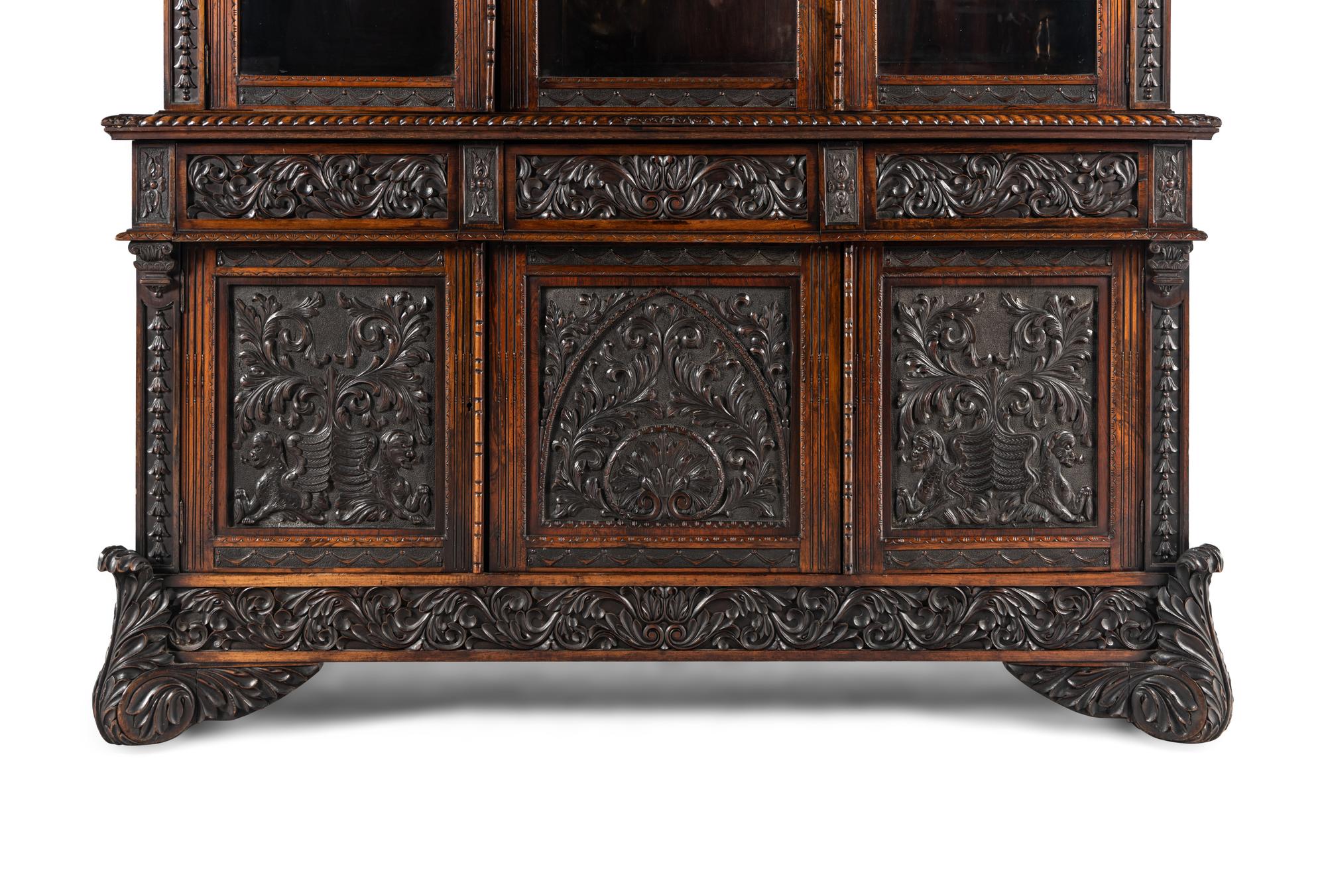An Italian Rosewood and Carved Walnut Bookcase