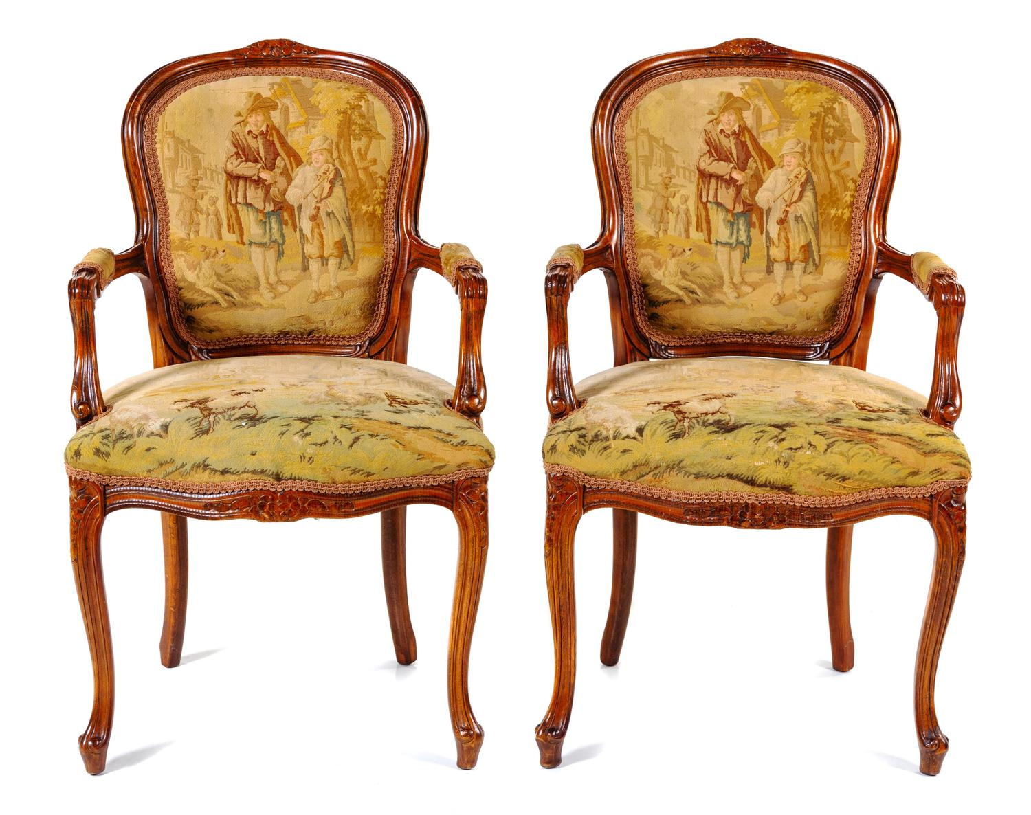 A Pair of Louis XV Fruitwood Fauteuils