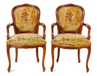 A Pair of Louis XV Fruitwood Fauteuils