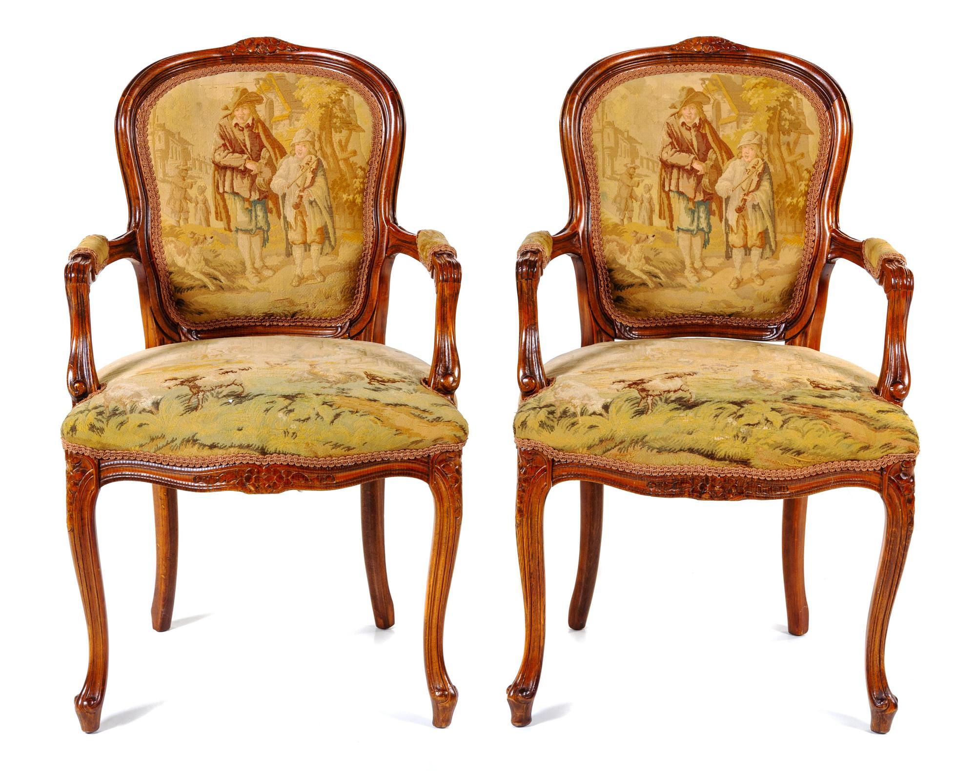 A Pair of Louis XV Fruitwood Fauteuils