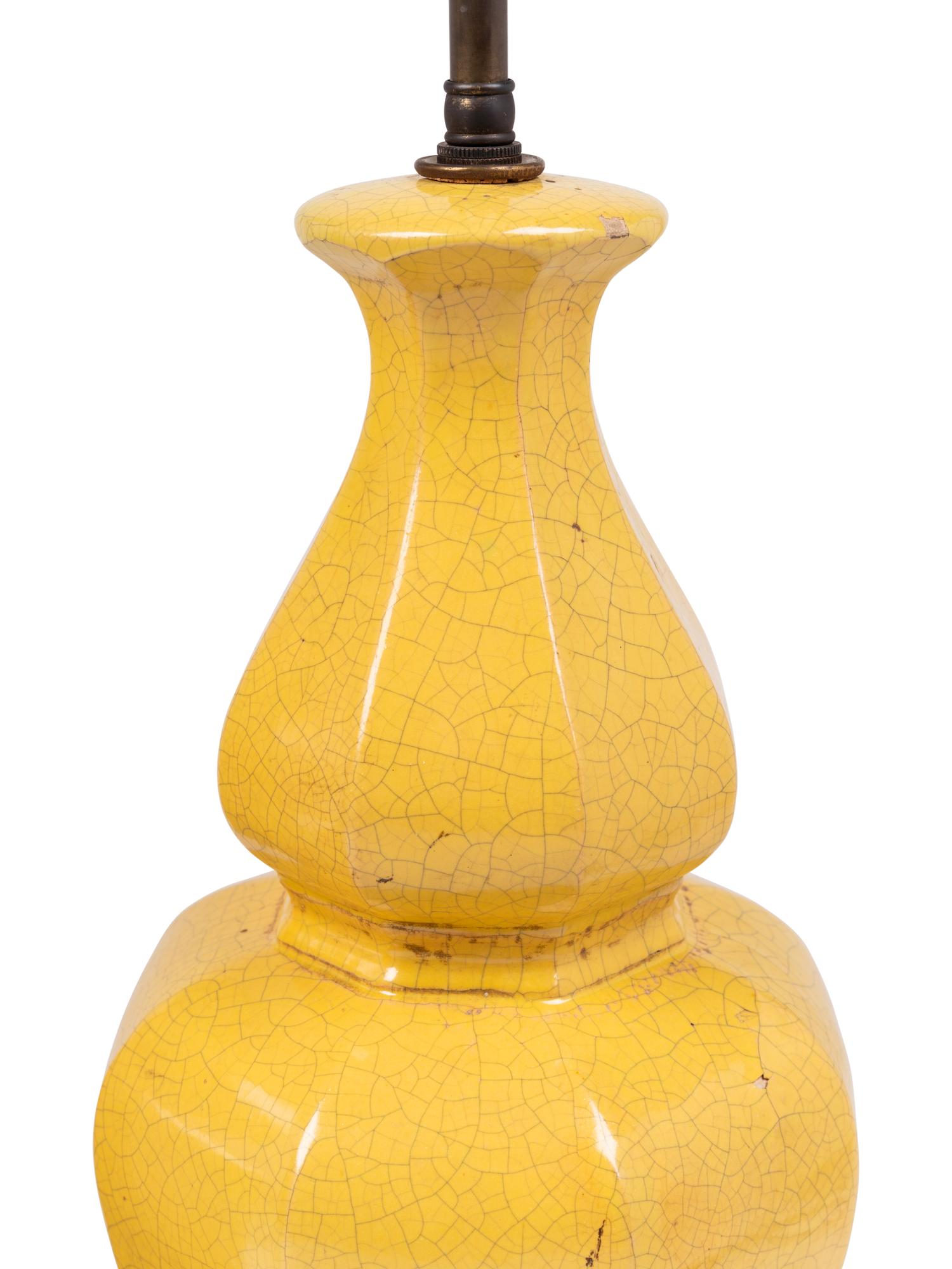 A Pair of Yellow Glazed Pottery Lamps