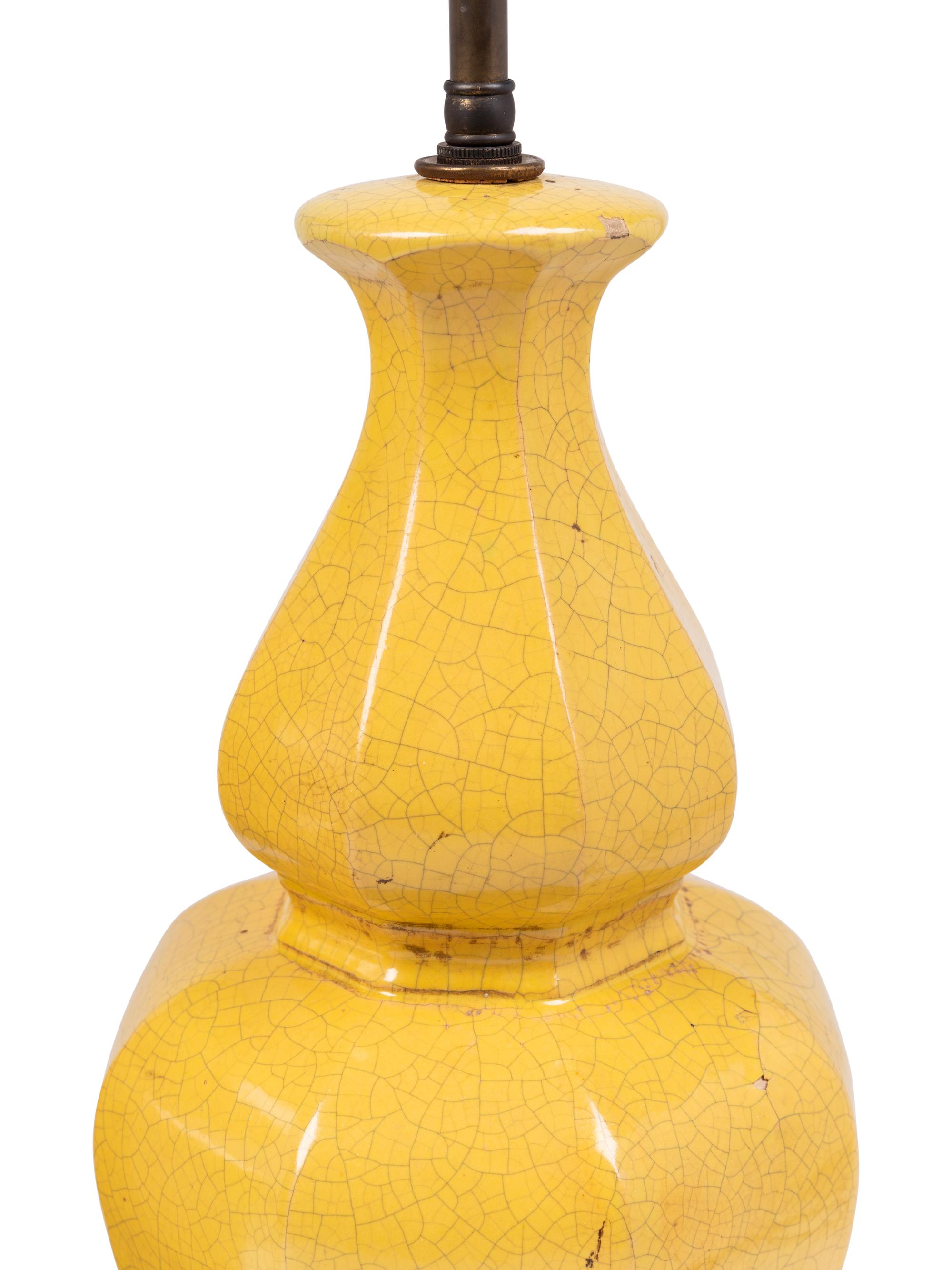 A Pair of Yellow Glazed Pottery Lamps