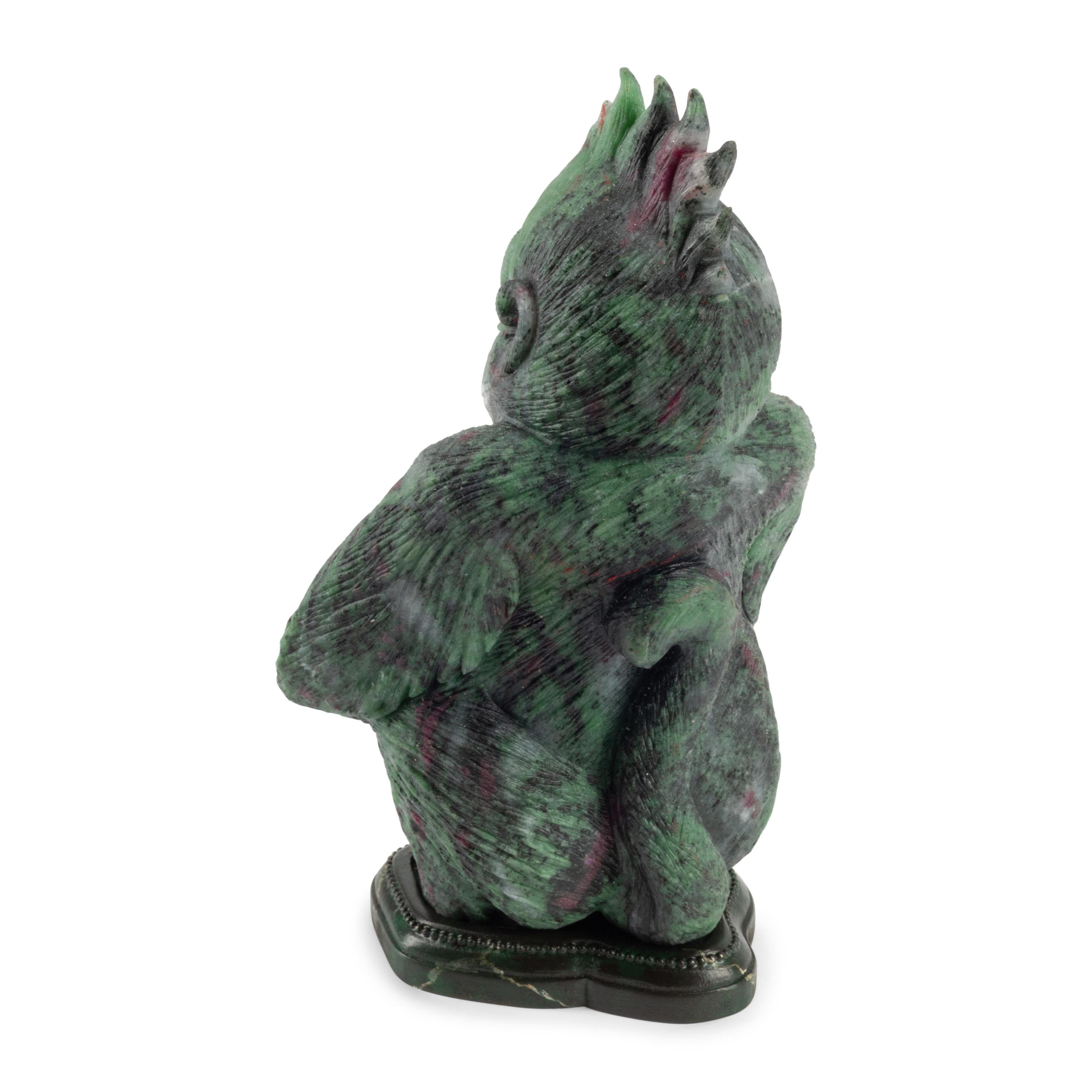A Carved Ruby Zoisite Figure of a Seated Monkey
