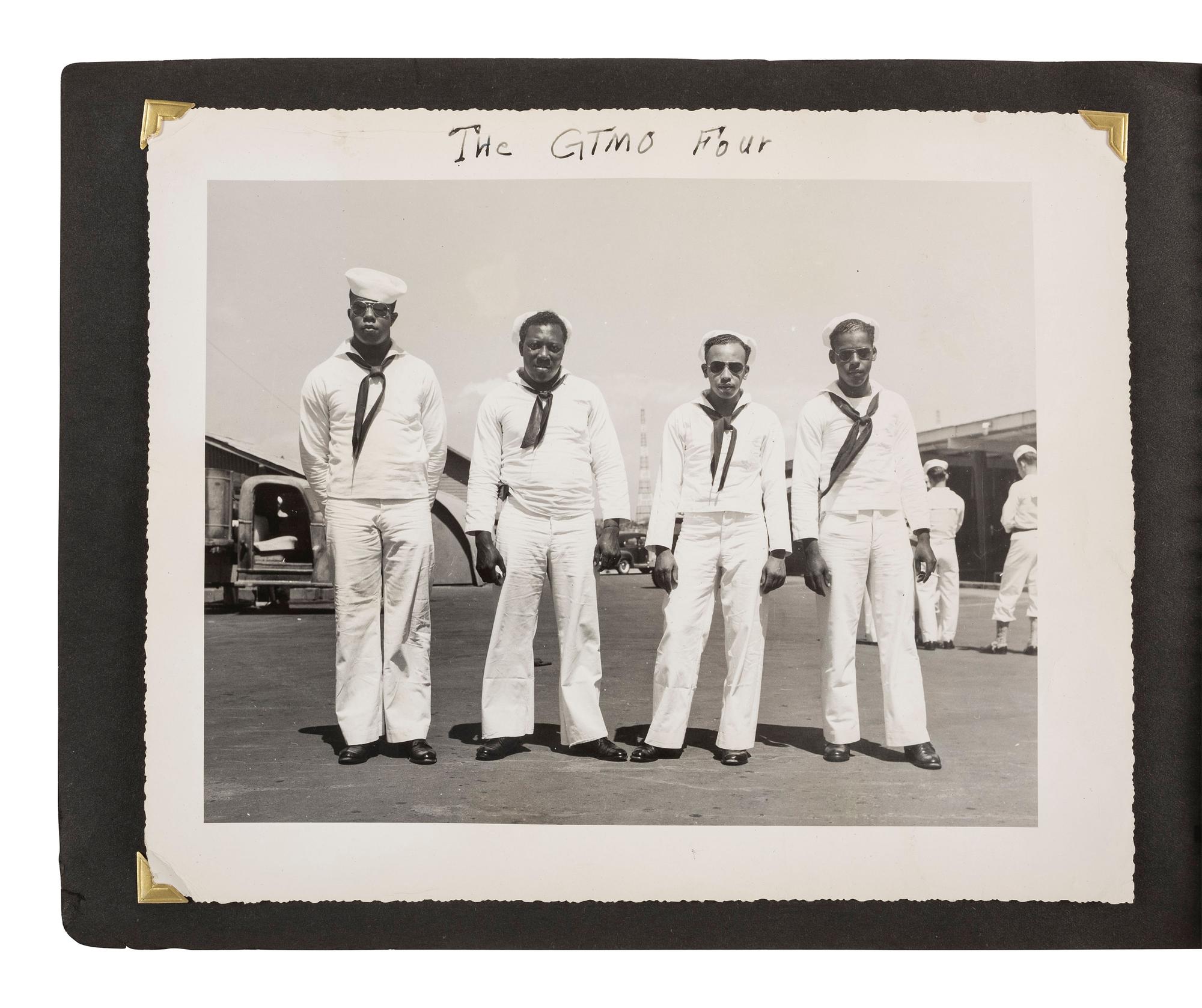 [KOREAN WAR]. Photograph album featuring African American sailors during the Korean War.