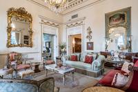 A Pair of Venetian Painted and Parcel Gilt Armchairs
