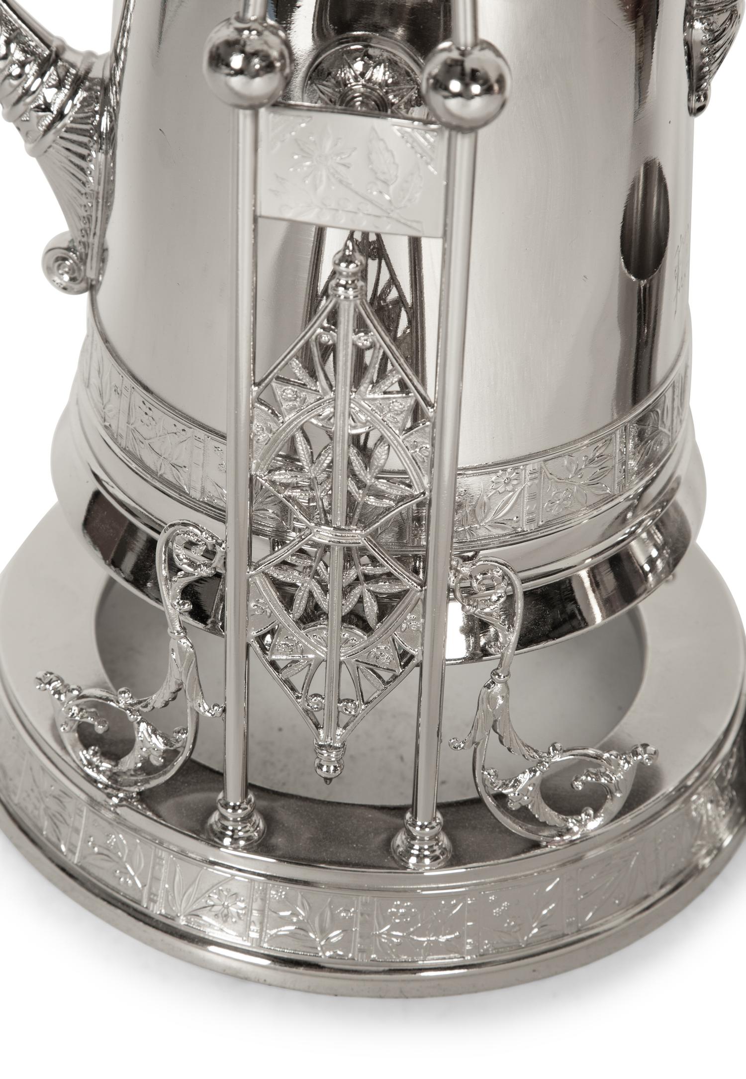 A Victorian Style Silver-Plated Tilting Pitcher and Goblet on Stand