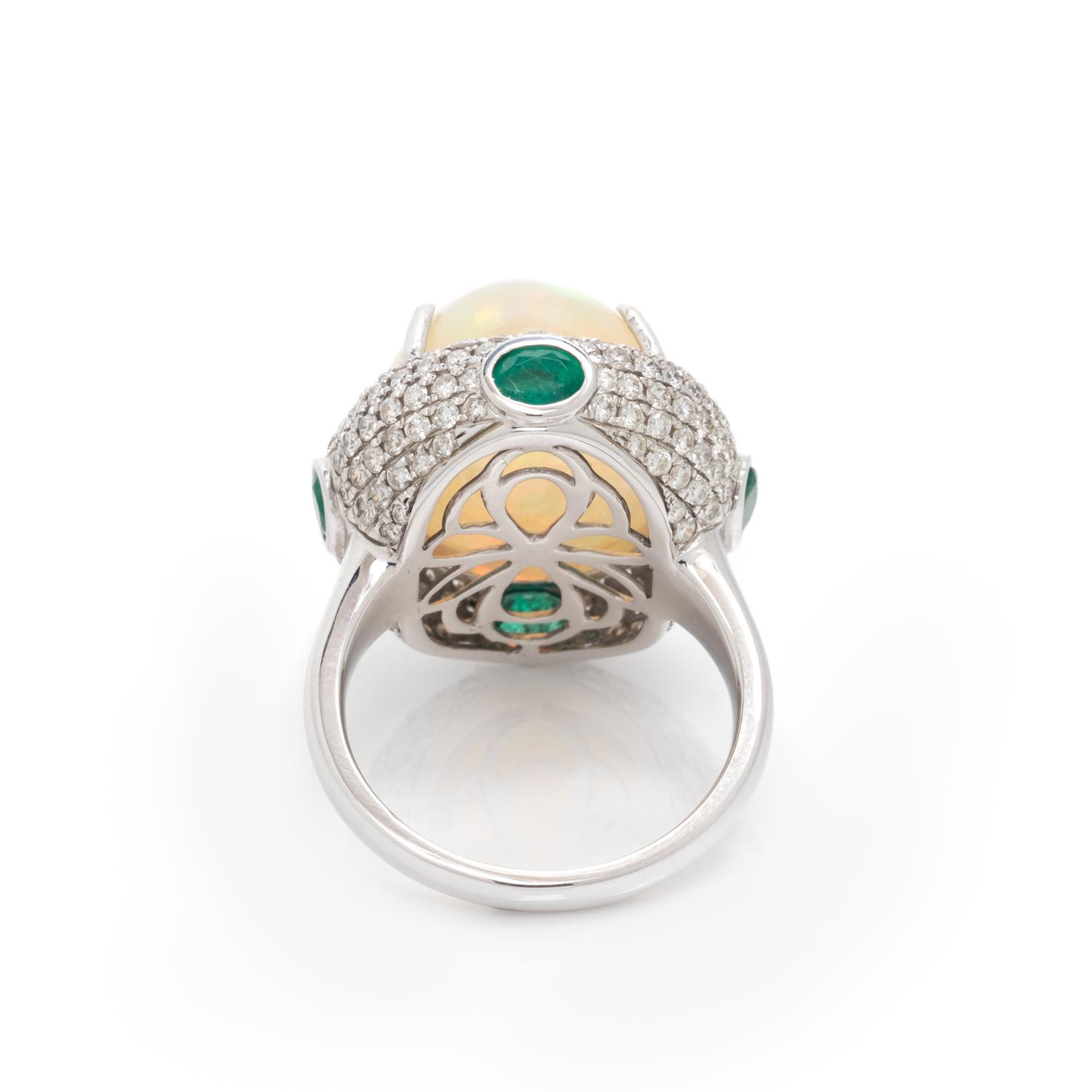 OPAL, DIAMOND AND EMERALD RING