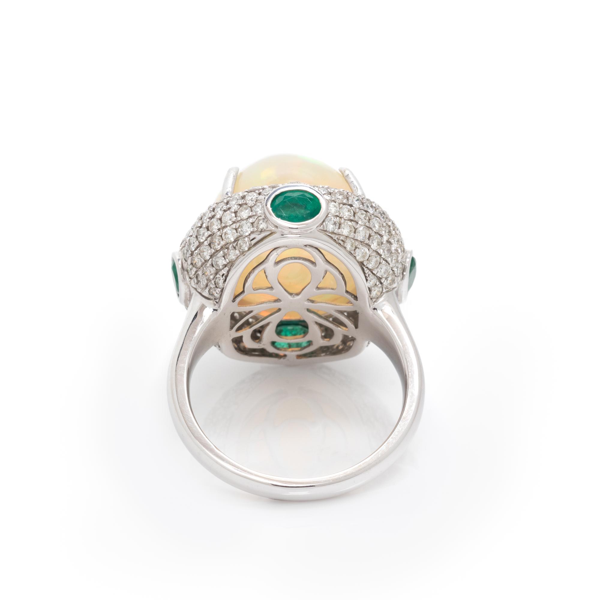 OPAL, DIAMOND AND EMERALD RING