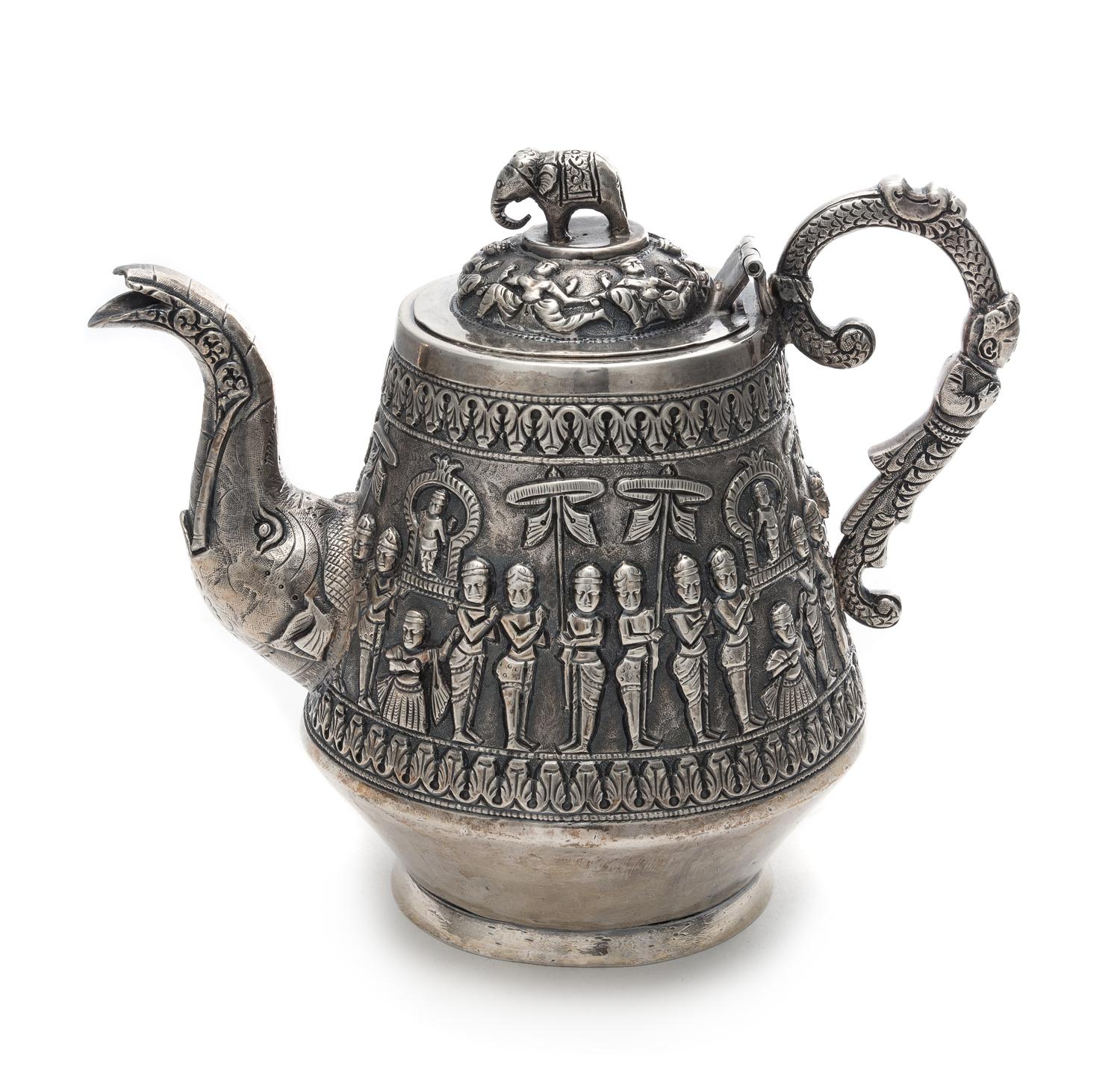 An Indian Silver Teapot Height 6 1/4 inches.