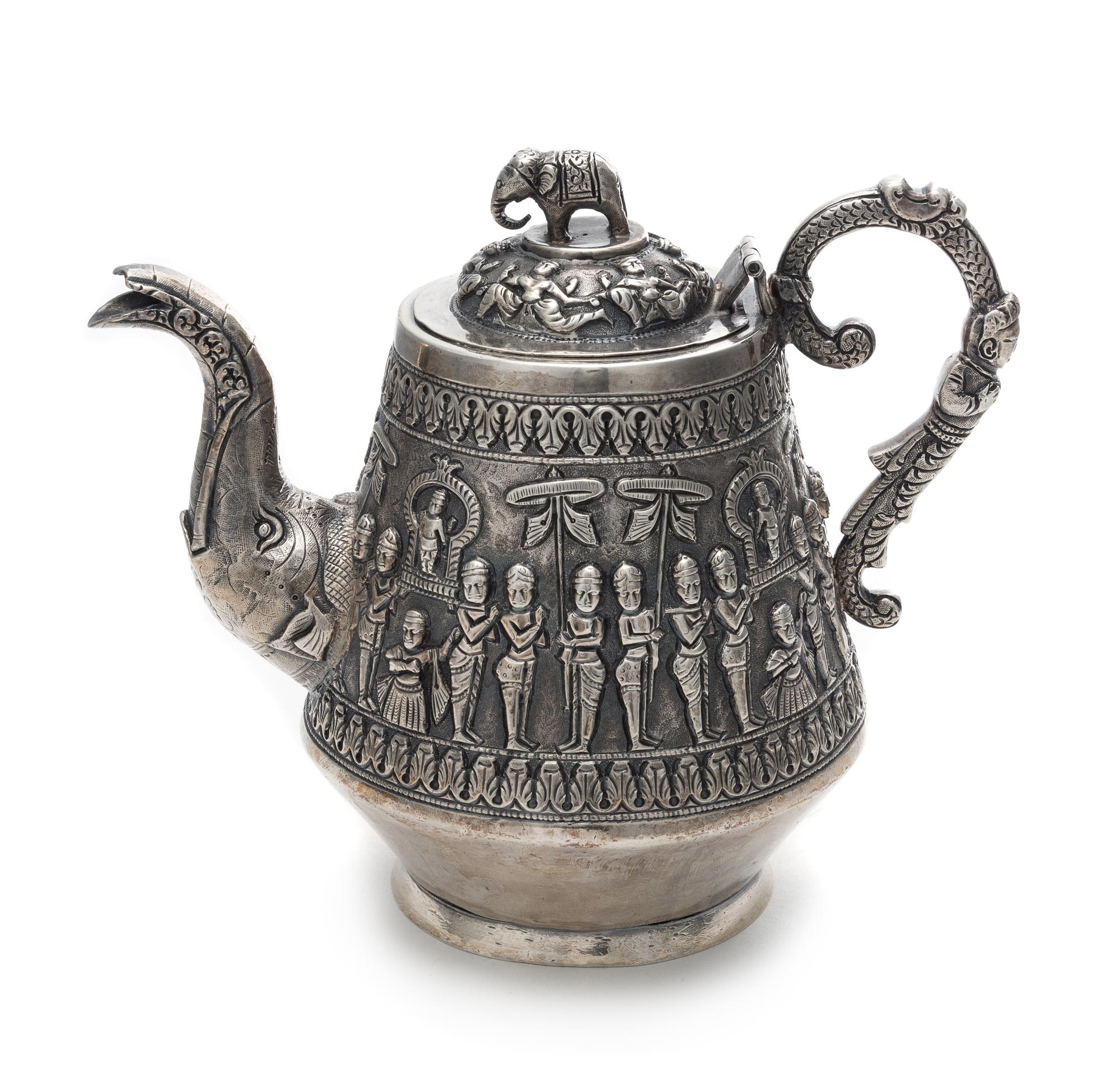 An Indian Silver Teapot Height 6 1/4 inches.