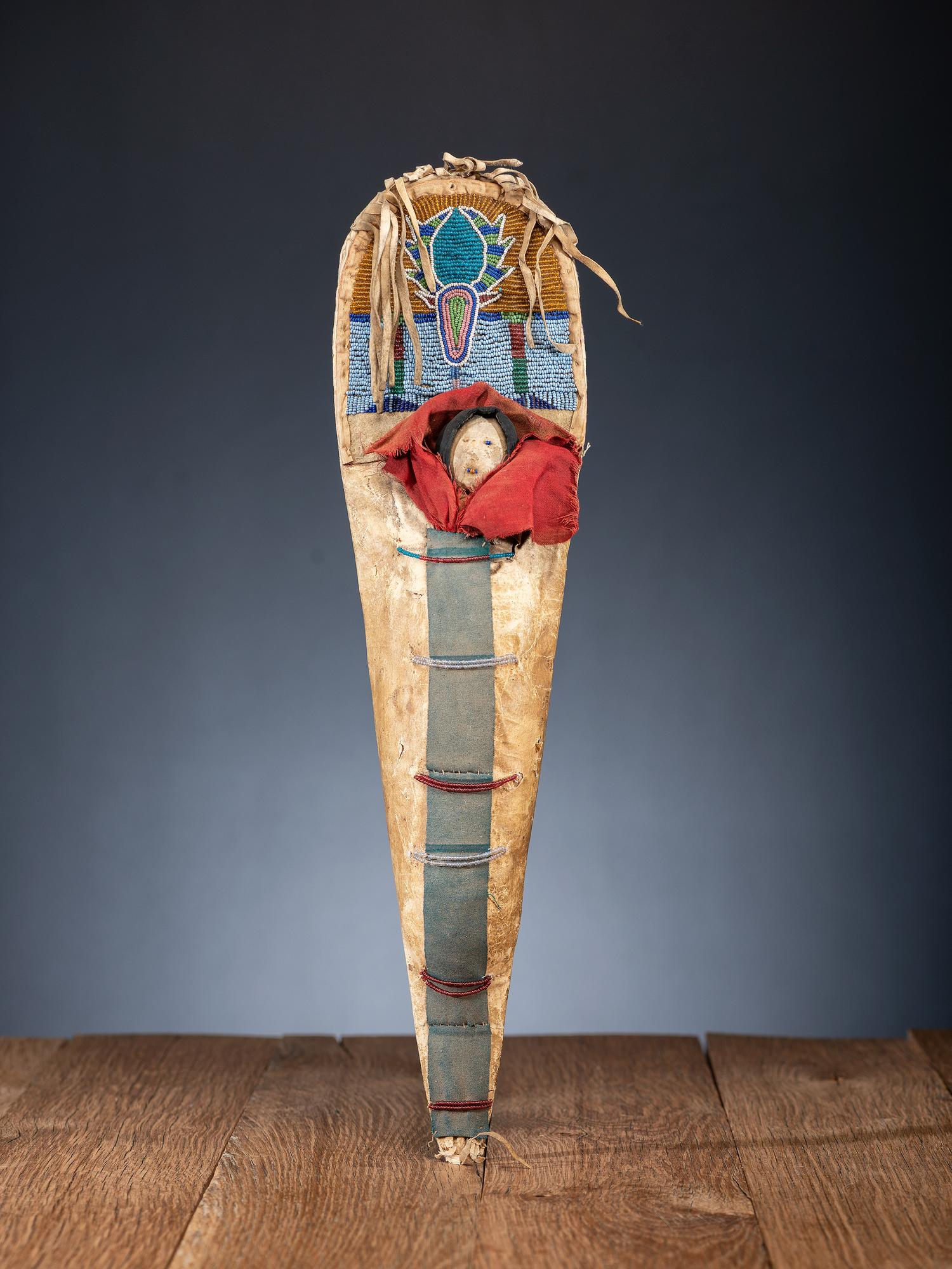 Nez Perce Beaded Hide Pictorial Toy Cradle, with Doll