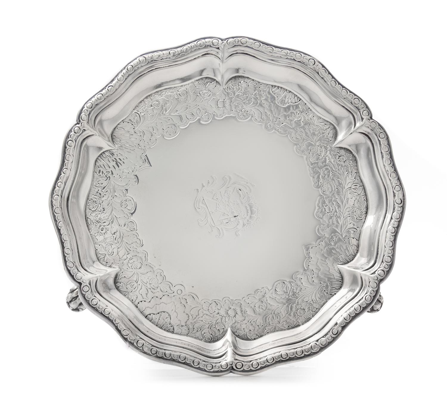 A George II Silver Salver, George Methuen, London, 1745, of circular form with a scalloped rim, the field chased with later floral and
