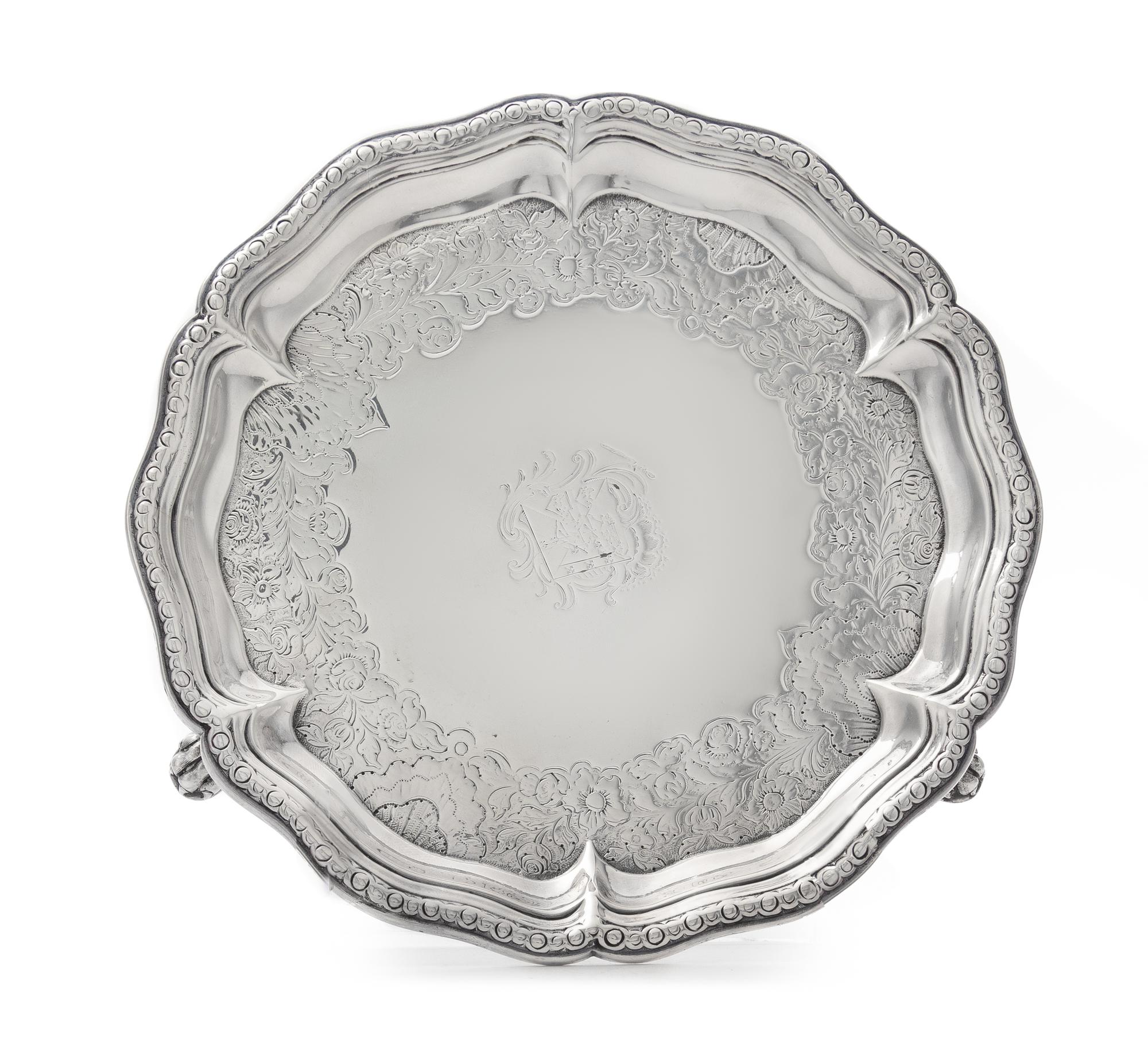 A George II Silver Salver, George Methuen, London, 1745, of circular form with a scalloped rim, the field chased with later floral and