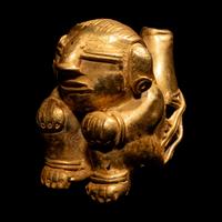 A Tairona Tumbaga Seated Female Figure