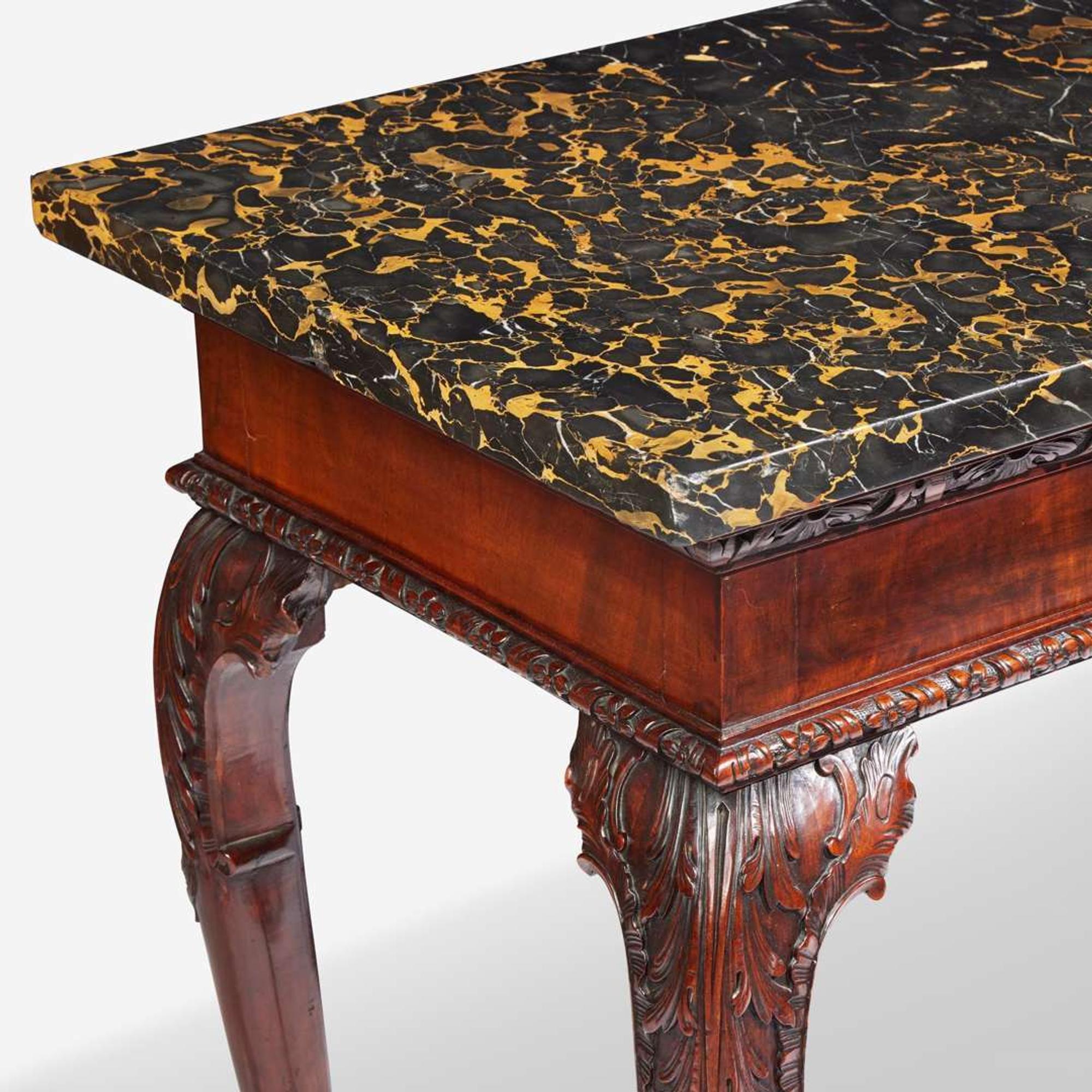A George II rectangular carved walnut side table with Portoro marble top mid-18th century