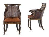 A Pair of William IV Parcel Gilt Japanned and Cane Upholstered Armchairs