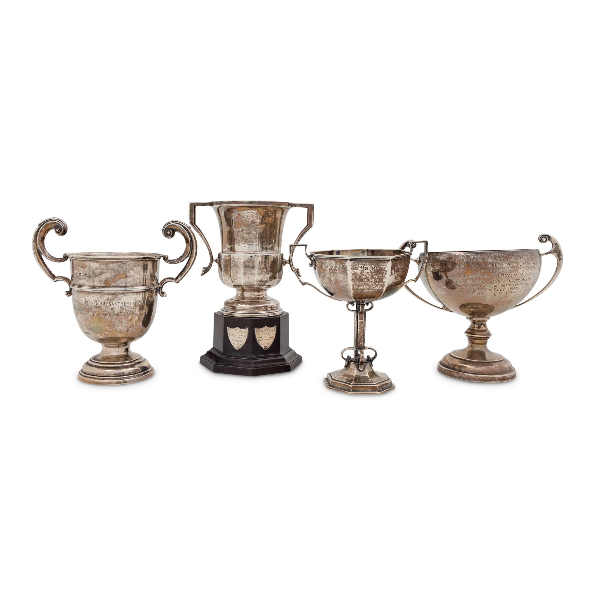 A Group of Four English Silver Twin-Handled Trophies