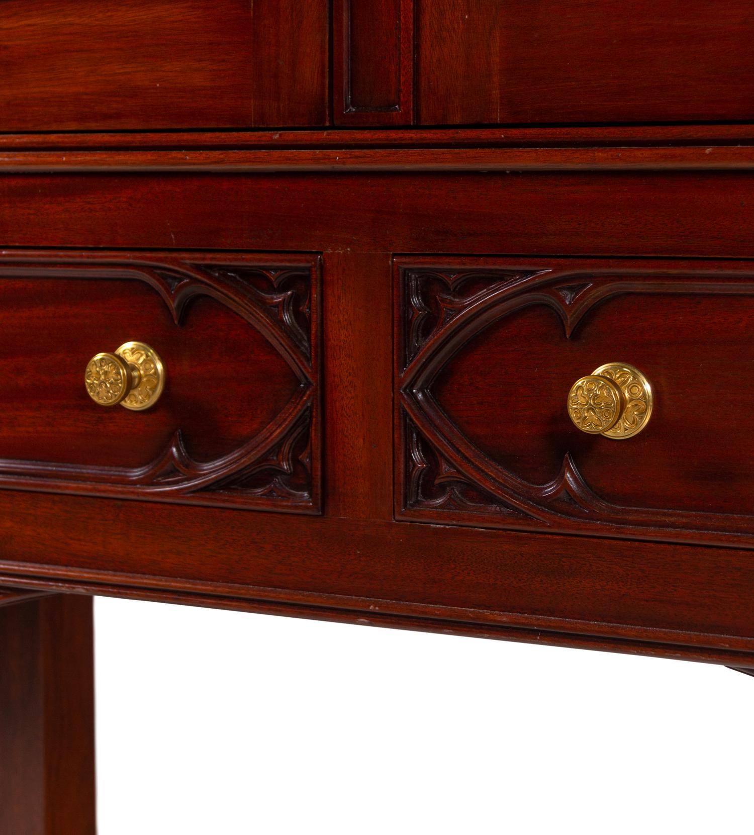 A Gothic Style Carved Mahogany Cabinet with P.E. Guerin Hardware