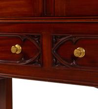 A Gothic Style Carved Mahogany Cabinet with P.E. Guerin Hardware