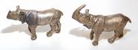 Two Bronze Rhinos. Width of wider 4 1/8 inches.