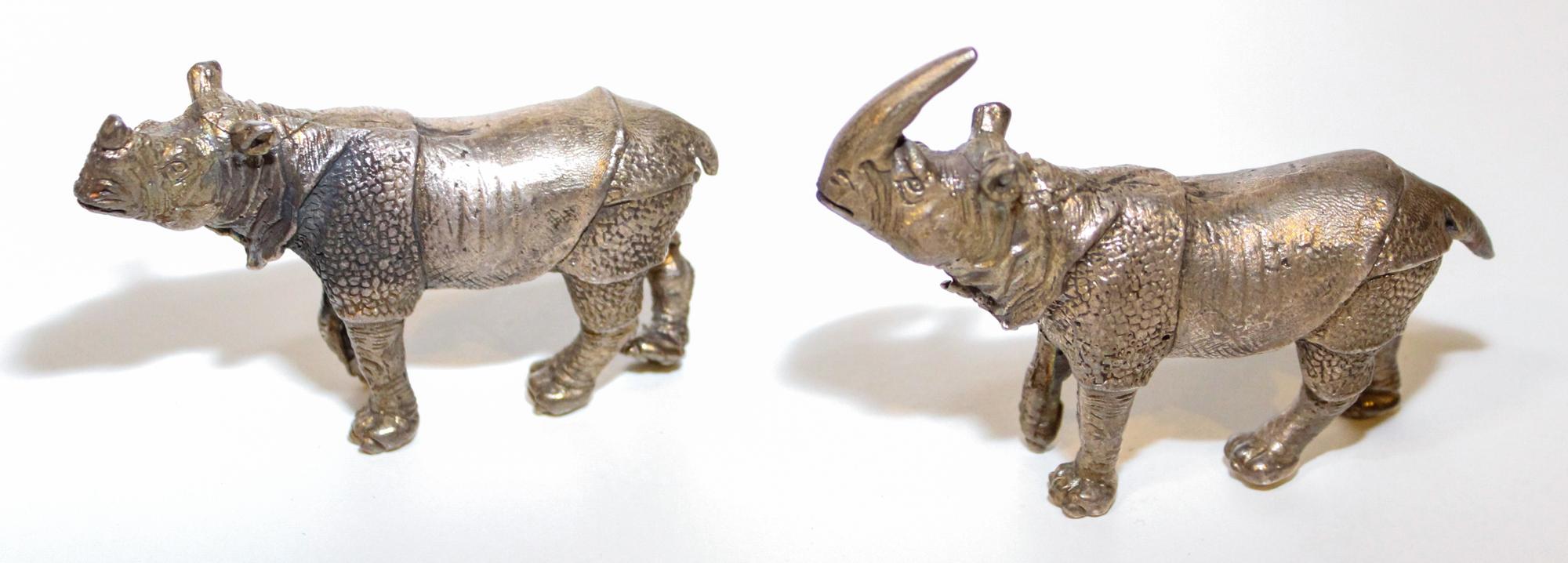 Two Bronze Rhinos. Width of wider 4 1/8 inches.