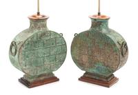 A Pair of Chinese Bronze Lamps Height 19 1/2 inches.