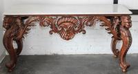 A Carved Mahogany Console Table. Height 33 1/2 x width 68 x depth 25 inches.
