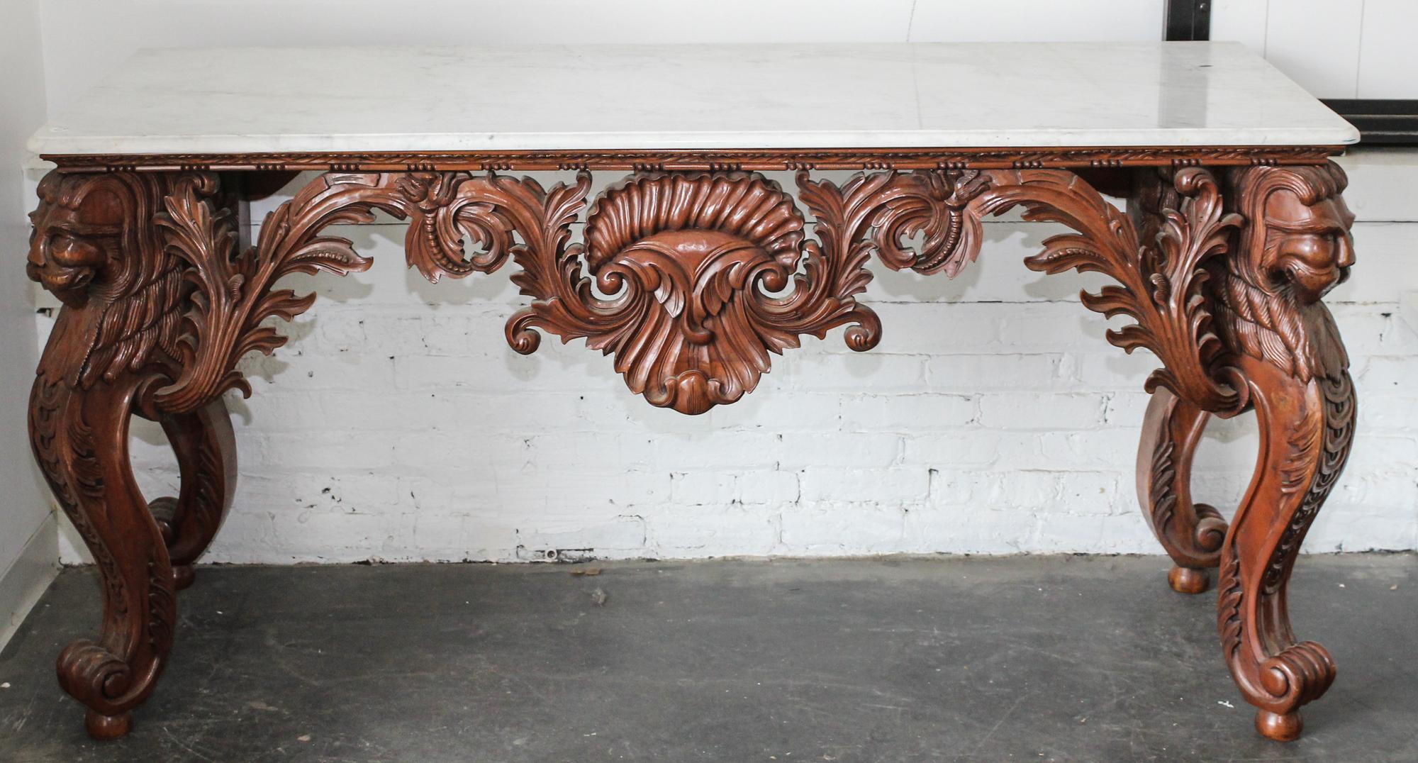 A Carved Mahogany Console Table. Height 33 1/2 x width 68 x depth 25 inches.