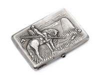 A Russian Silver Cigarette Case, Maker's mark Cyrillic GE, Moscow, the lid worked to show a warrior on horseback mourning at a gravesto